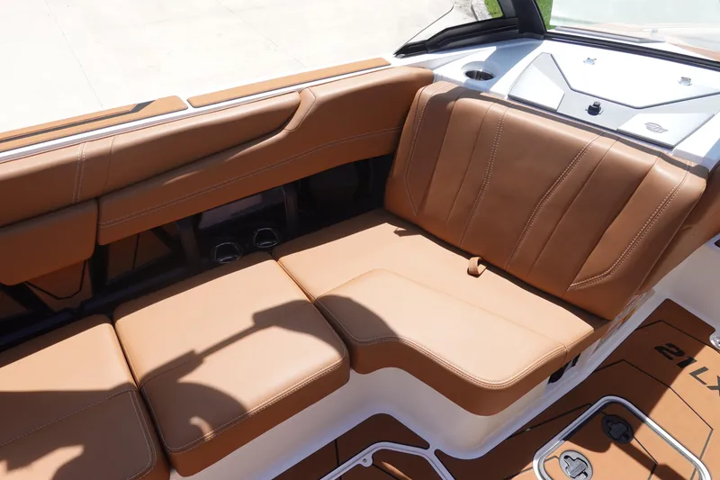 Slide: The Image of 2026 Malibu Wakesetter 21 LX interior with tan leather seating and sleek design. - 19