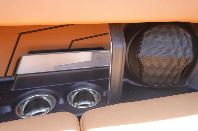 Slide: The Image of Interior of 2026 Malibu Wakesetter 21 LX with cup holders and speaker. - 21