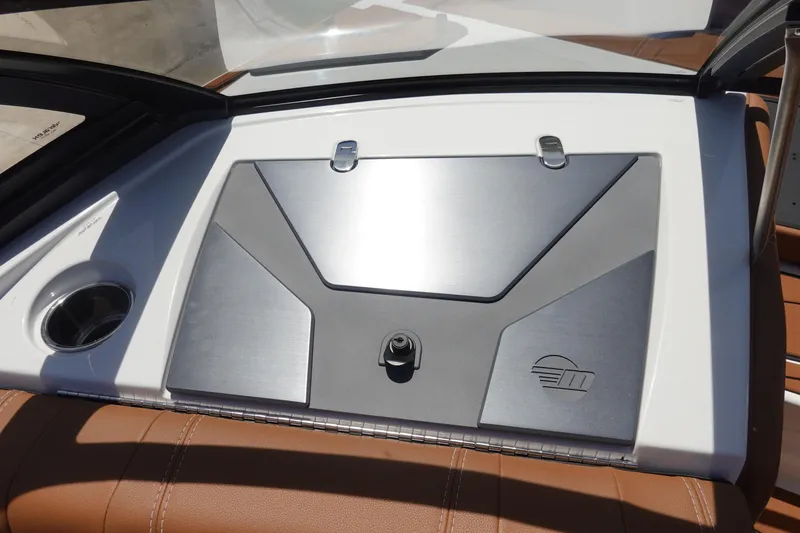 Slide: The Image of 2026 Malibu Wakesetter 21 LX dashboard with sleek design and cup holder. - 28