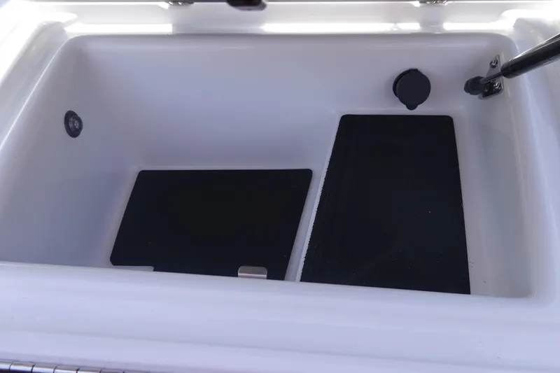 Slide: The Image of Storage compartment of 2026 Malibu Wakesetter 21 LX boat, featuring sleek design. - 29