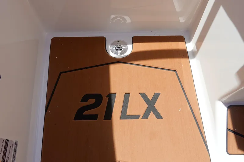 Slide: The Image of 2026 Malibu Wakesetter 21 LX boat deck with logo and drain. - 30