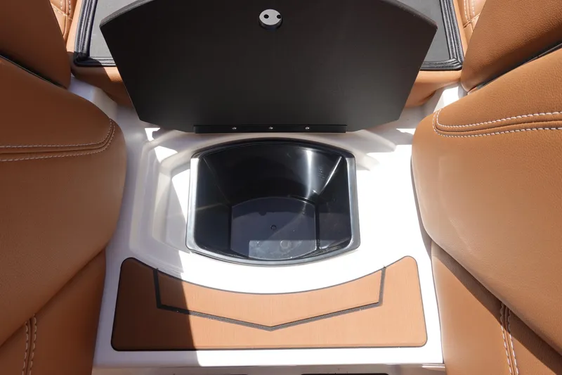 Slide: The Image of 2026 Malibu Wakesetter 21 LX interior storage compartment with tan leather seats. - 31