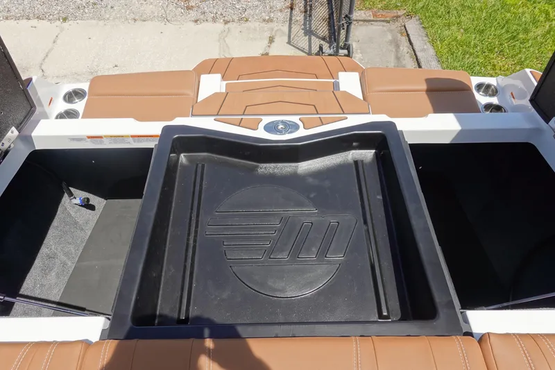 Slide: The Image of 2026 Malibu Wakesetter 21 LX boat interior with storage compartments and seating. - 36