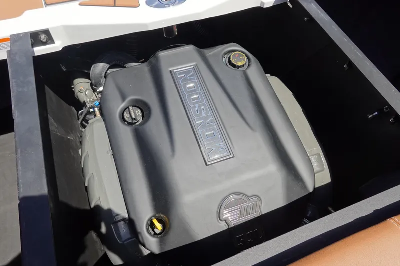 Slide: The Image of Engine compartment of 2026 Malibu Wakesetter 21 LX boat, featuring Monsoon engine. - 37
