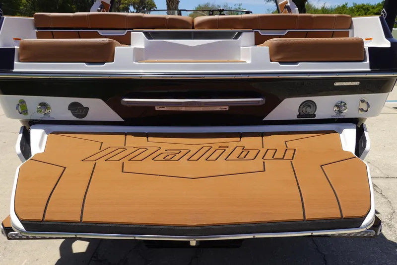 Slide: The Image of 2026 Malibu Wakesetter 21 LX boat with teak swim platform and brown seating. - 5