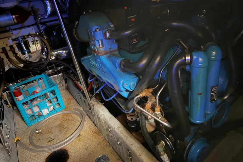 Slide: The Image of Engine room of a 1997 Silverton 442 Cockpit Motor Yacht with visible machinery and components. - 10