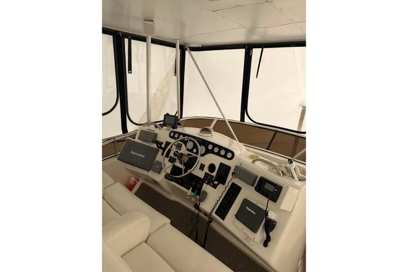 Slide: The Image of Interior helm of 1997 Silverton 442 Cockpit Motor Yacht with navigation equipment. - 7