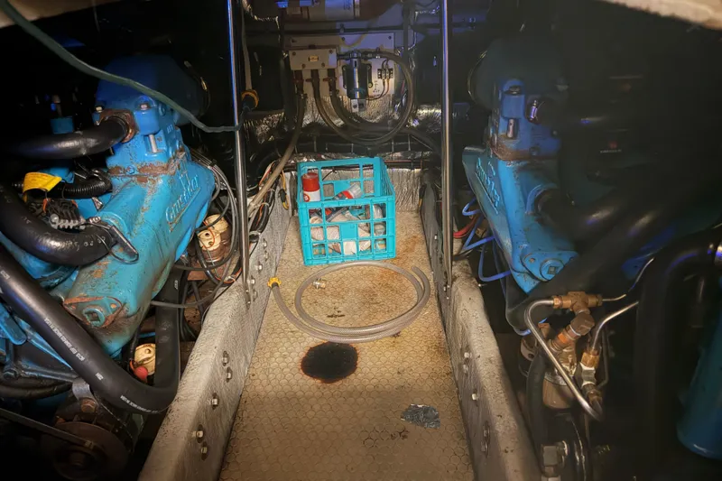 Slide: The Image of Engine room of 1997 Silverton 442 Cockpit Motor Yacht with visible machinery and components. - 9