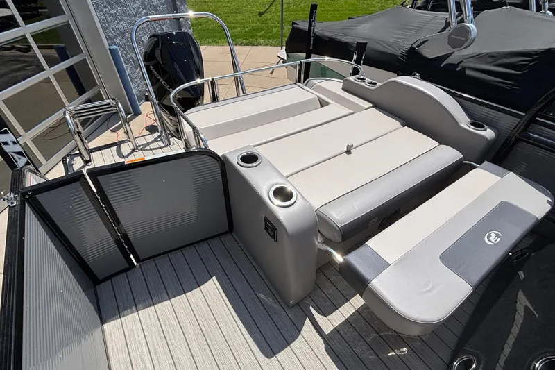 Slide: The Image of 2023 Princecraft Quorum 25 RL boat interior with seating and cup holders. - 15