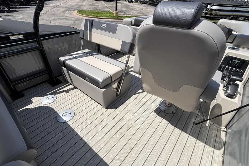 Slide: The Image of 2023 Princecraft Quorum 25 RL boat interior with seating and control panel. - 22