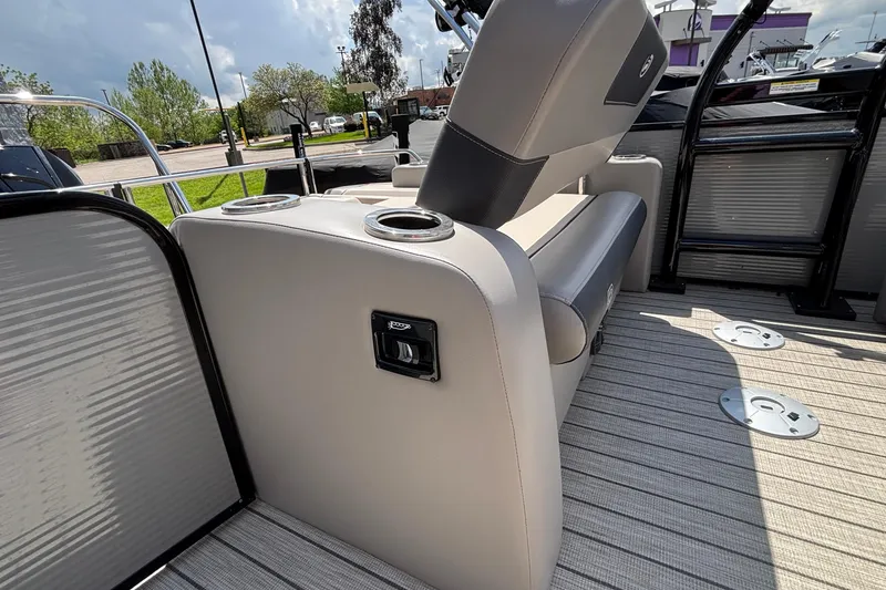 Slide: The Image of 2023 Princecraft Quorum 25 RL boat interior with seating and cup holders. - 23