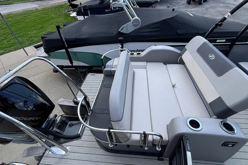 Slide: The Image of 2023 Princecraft Quorum 25 RL boat with sleek seating and Mercury engine. - 24