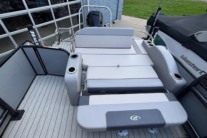 Slide: The Image of 2023 Princecraft Quorum 25 RL boat with spacious seating and cup holders. - 25