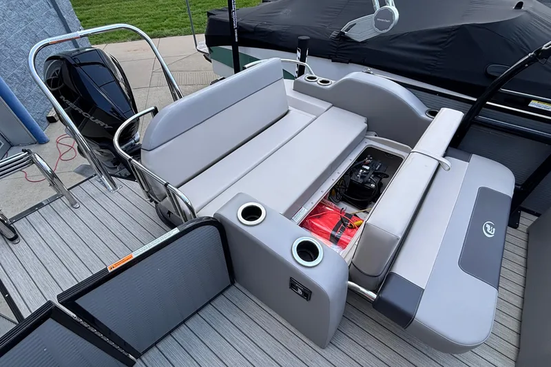 Slide: The Image of 2023 Princecraft Quorum 25 RL boat interior with seating and storage compartments. - 26