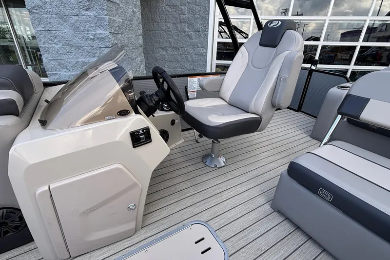 Slide: The Image of 2023 Princecraft Quorum 25 RL boat interior with captain's chair and console. - 30