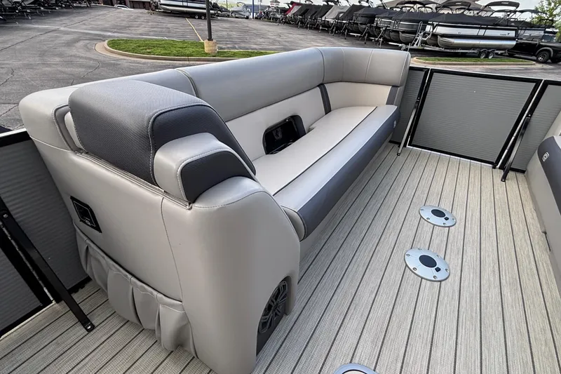 Slide: The Image of 2023 Princecraft Quorum 25 RL pontoon boat interior with sleek seating and modern design. - 34