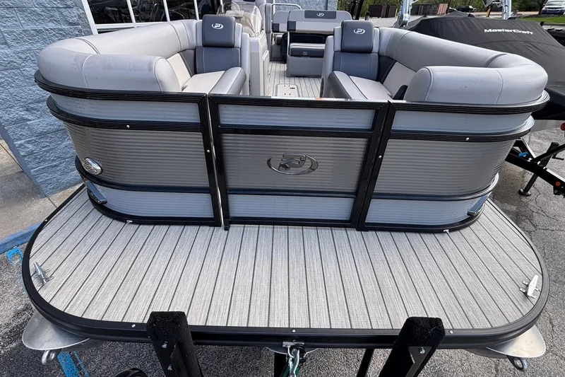 Slide: The Image of 2023 Princecraft Quorum 25 RL pontoon boat with spacious seating and sleek design. - 42