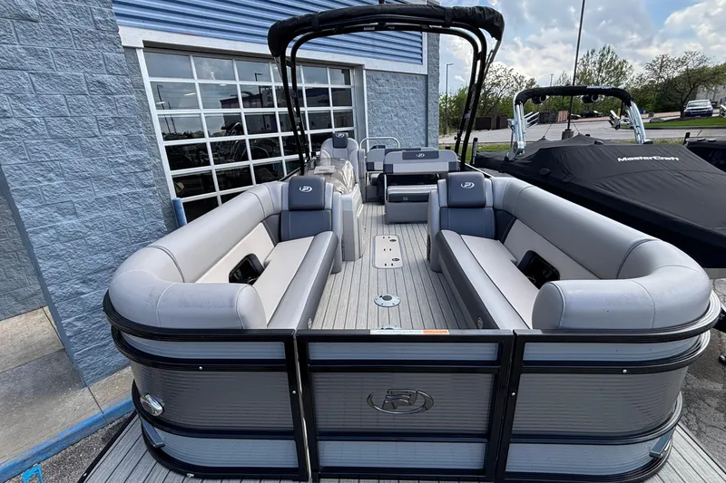 Slide: The Image of 2023 Princecraft Quorum 25 RL pontoon boat with spacious seating and sleek design. - 43