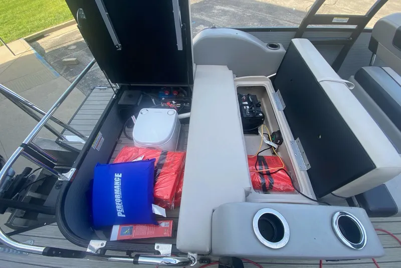 Slide: The Image of 2023 Princecraft Quorum 25 RL boat interior with storage compartments and safety equipment. - 44