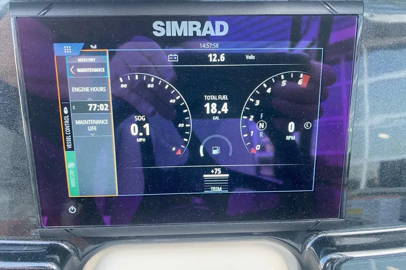 Slide: The Image of Simrad display on 2023 Princecraft Quorum 25 RL showing engine data and fuel levels. - 46