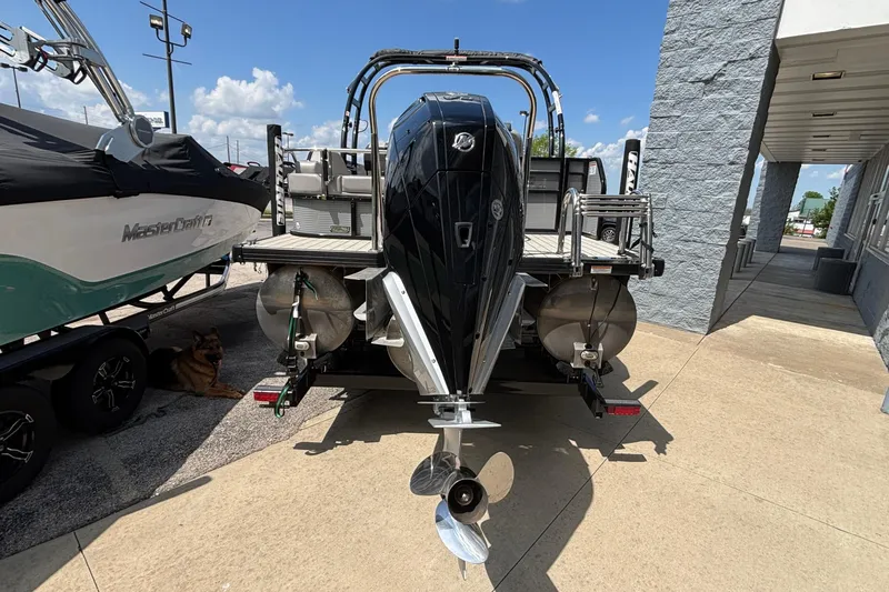 Slide: The Image of 2023 Princecraft Quorum 25 RL pontoon boat with powerful outboard motor. - 7