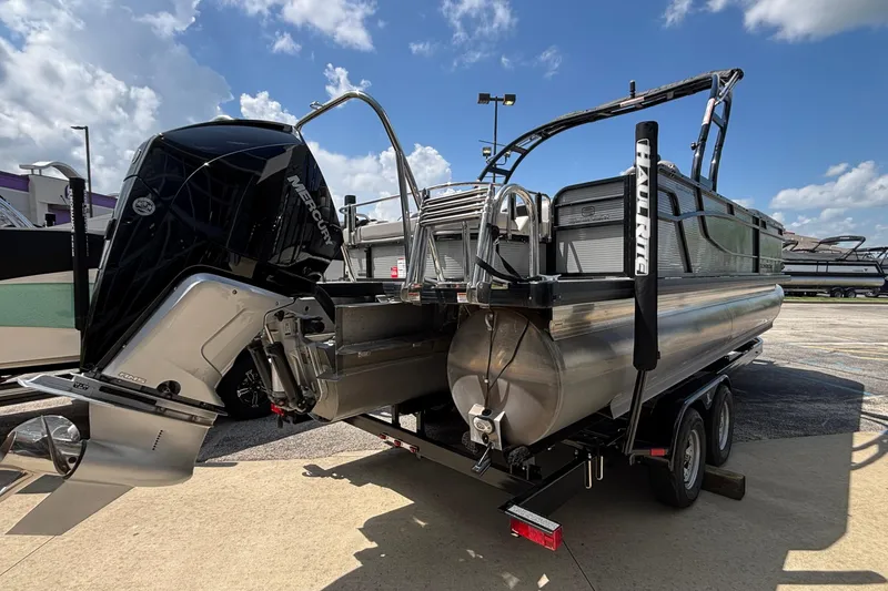 Slide: The Image of 2023 Princecraft Quorum 25 RL pontoon boat with Mercury engine on trailer. - 9
