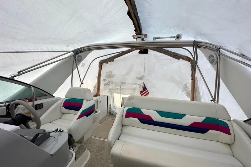 Slide: The Image of Interior of a 1997 Formula 34 Performance Cruiser with colorful seating and steering wheel. - 11