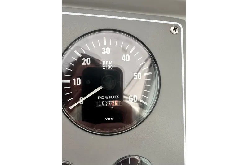 Slide: The Image of Close-up of a 1997 Formula 34 Performance Cruiser RPM gauge showing engine hours. - 14