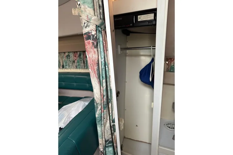 Slide: The Image of Interior of a 1997 Formula 34 Performance Cruiser with closet and seating area. - 27