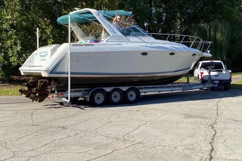 Slide: The Image of 1997 Formula 34 Performance Cruiser on trailer, towed by a white truck. - 3