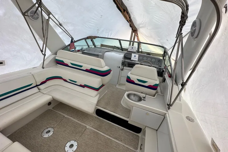 Slide: The Image of 1997 Formula 34 Performance Cruiser interior with seating and helm under cover. - 8