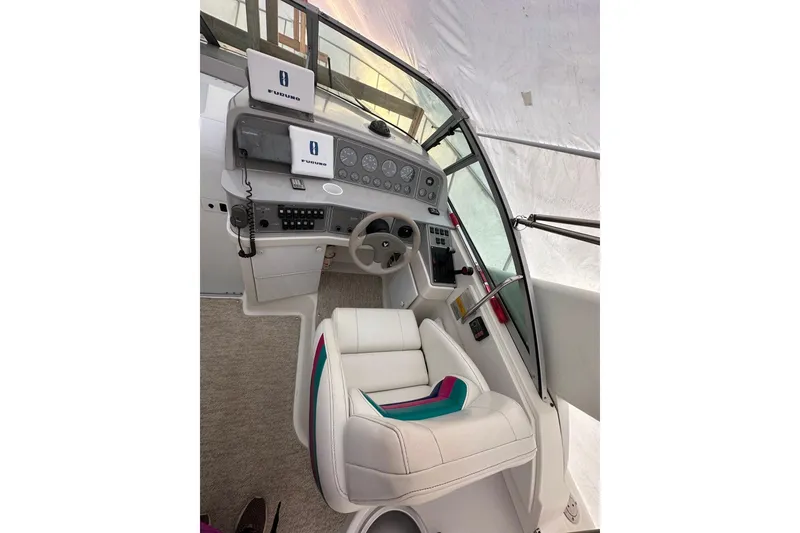 Slide: The Image of Interior cockpit of a 1997 Formula 34 Performance Cruiser with modern navigation equipment. - 9