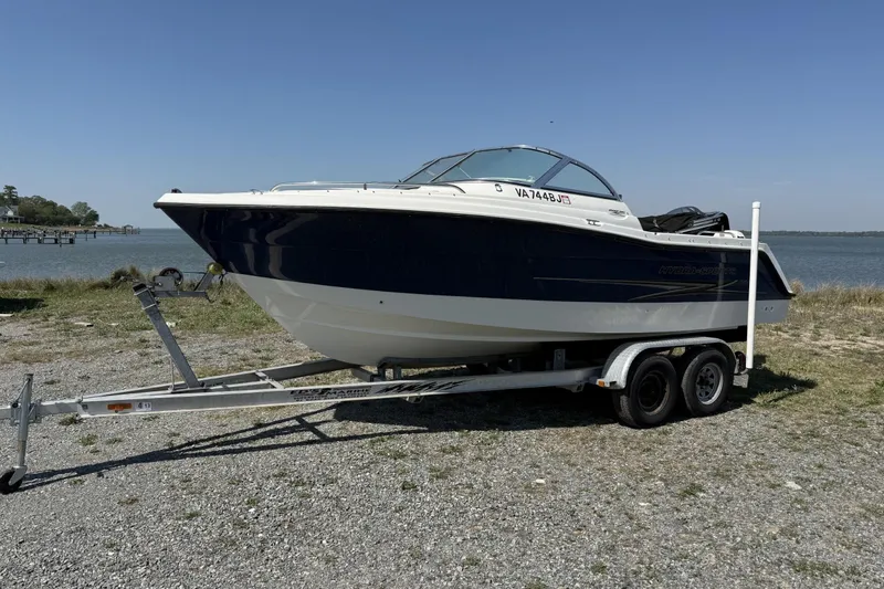 The Image of 2004 Hydra-Sports Lightning 202 DC boat on trailer by the water. - 0