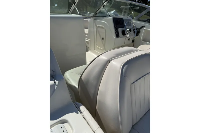 Slide: The Image of 2004 Hydra-Sports Lightning 202 DC boat interior with white seating and steering console. - 3