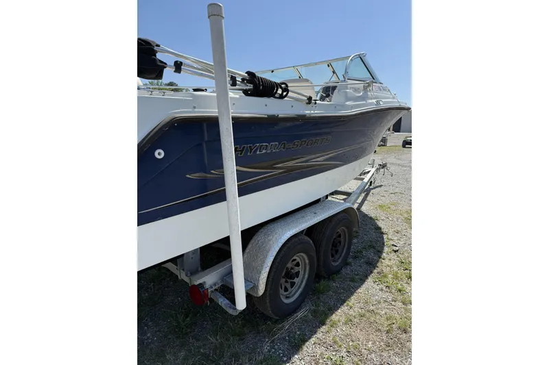 Slide: The Image of 2004 Hydra-Sports Lightning 202 DC boat on trailer, parked outdoors under clear sky. - 6