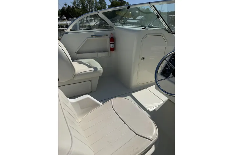 Slide: The Image of 2004 Hydra-Sports Lightning 202 DC boat interior with seating and steering wheel. - 8