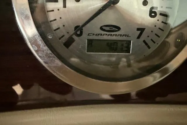 Slide: The Image of Close-up of a Chaparral 216 SSi 2002 boat gauge displaying 403 hours. - 14