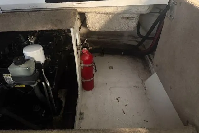 Slide: The Image of Engine compartment of a 2002 Chaparral 216 SSi boat with fire extinguisher. - 19