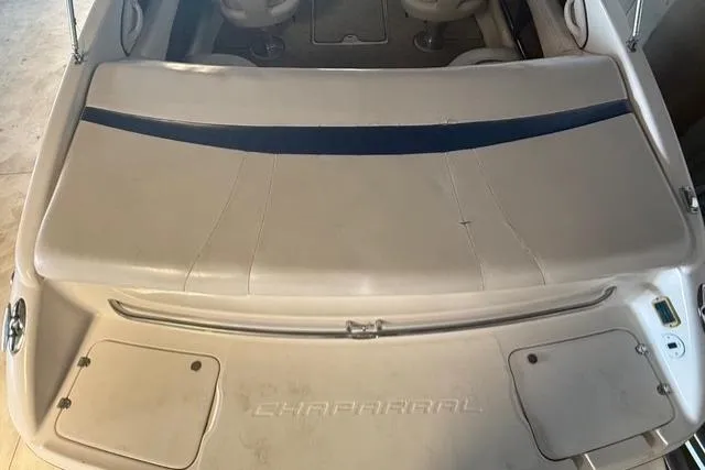 Slide: The Image of 2002 Chaparral 216 SSi boat interior with seating and storage compartments. - 20