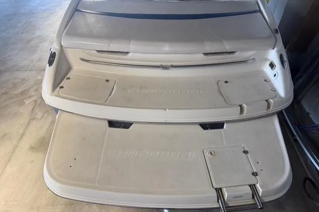 Slide: The Image of 2002 Chaparral 216 SSi boat swim platform with integrated ladder and storage compartments. - 22