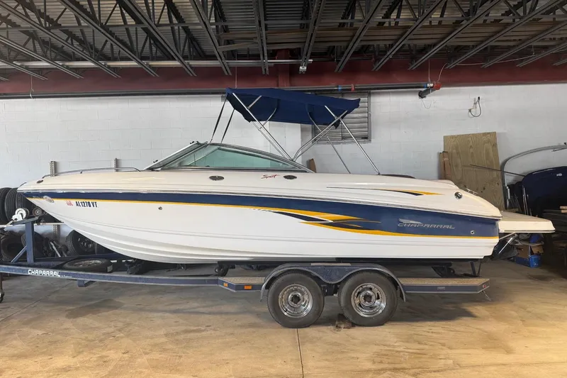 Slide: The Image of 2002 Chaparral 216 SSi boat on trailer in indoor storage. - 3