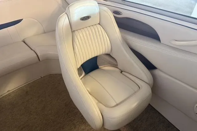 Slide: The Image of 2002 Chaparral 216 SSi boat interior with plush white seating and elegant design. - 8