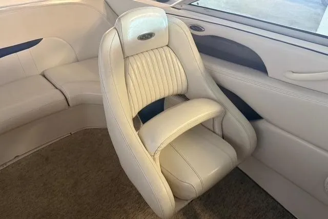 Slide: The Image of 2002 Chaparral 216 SSi boat interior with plush white seating and elegant design. - 9