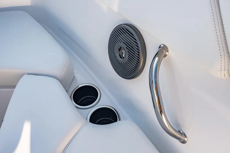 Slide: The Image of Interior of 2026 Four Winns H1 OB boat with speaker, cup holders, and handle. - 30