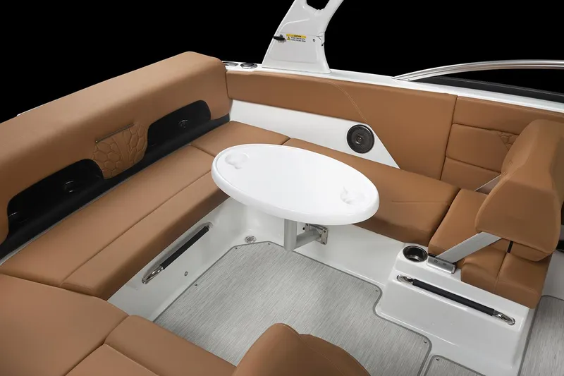 Slide: The Image of Manufacturer Provided Image: 2025 Four Winns H1 OB boat interior with brown seating and a white table. - 12