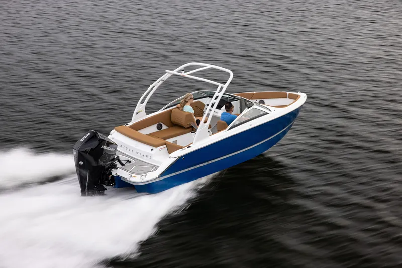 Slide: The Image of 2026 Four Winns H1 OB boat cruising on open water, featuring sleek design and powerful engine. - 4