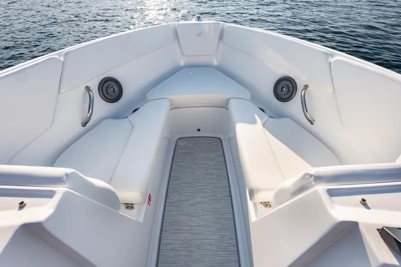Slide: The Image of 2026 Four Winns H1 OB boat interior with white seating and ocean view. - 23