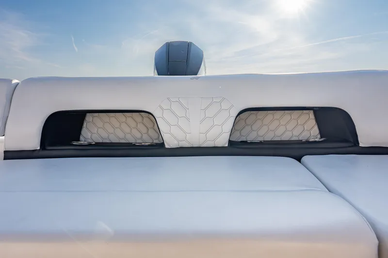 Slide: The Image of 2026 Four Winns H1 OB boat interior with sleek white seating and modern design. - 20