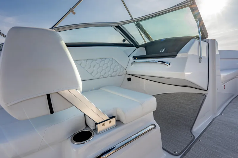 Slide: The Image of 2026 Four Winns H1 OB boat interior with white seating and modern dashboard. - 28