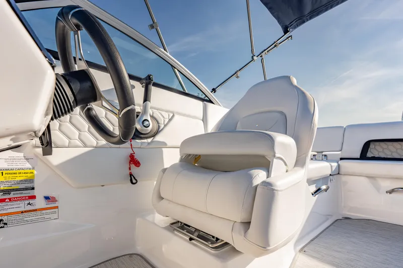 Slide: The Image of 2026 Four Winns H1 OB boat interior with steering wheel and luxurious seating. - 18